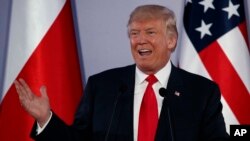 President Donald Trump speaks during a news conference with Polish President Andrzej Duda at Royal Castle in Warsaw, July 6, 2017. 