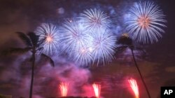 Fireworks from Nagaoka City, Japan, explode over Ford Island to celebrate the 70th anniversary of the end of World War II at Joint Base Pearl Harbor-Hickam, in Honolulul, Aug. 15, 2015.