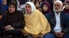 Relatives of Afghan woman, 27-year-old Farkhunda, who was beaten to death by a mob, attend a hearing at a court in Kabul on May 6, 2015. Four Afghan men were sentenced to death for the savage lynching of a woman falsely accused of blasphemy, a landmark judgment in a nation where female victims often have little legal recourse.