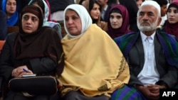 Relatives of Afghan woman, 27-year-old Farkhunda, who was beaten to death by a mob, attend a hearing at a court in Kabul on May 6, 2015. Four Afghan men were sentenced to death for the savage lynching of a woman falsely accused of blasphemy, a landmark judgment in a nation where female victims often have little legal recourse.