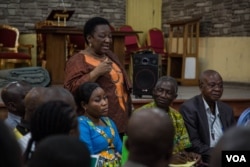 Gertrude Ekombe is very involved in the church's pro-democracy activism. She speaks at a meeting at St. Joseph Catholic Church. (C. Oduah/VOA)