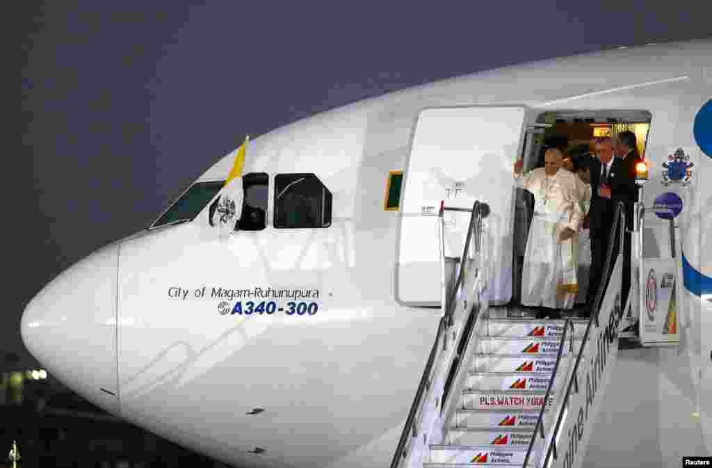 Pope Francis arrives at Villamor Air Base in Manila, for a state and pastoral visit, Jan. 15, 2015.