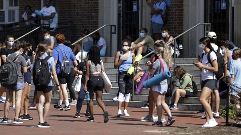 As Some US College Students Party, Others Report Them