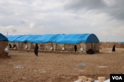 The al-Hol Camp in northern Syria was built for 10,000 people, but the population has now swelled to 72,000 and continues to grow, pictured in al-Hol Camp, Syria on March, 4, 2019. (H.Murdock/VOA)