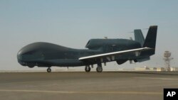 In this Feb. 13, 2018, photo released by the U.S. Air Force, an RQ-4 Global Hawk is seen on the tarmac of Al-Dhafra Air Base near Abu Dhabi, United Arab Emirates. Iran's Revolutionary Guard shot down a U.S. RQ-4 Global Hawk on Thursday, June 20, 2019. 