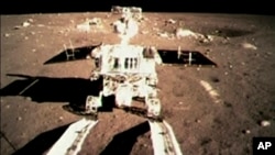 FILE - China's first moon rover 'Jade Rabbit' touch the lunar surface and leave deep traces on its loose soil.