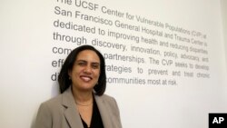 FILE - Dr. Kirsten Bibbins-Domingo poses at her office in San Francisco, April 7, 2017. Draft recommendations from the U.S. Preventive Services Task Force ditch the old advice against PSA screening and say whether to get tested should be left up to men aged aged 55 to 69 after being informed of the potential benefits and harms. 