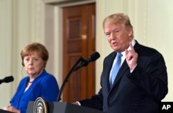 FILE - President Donald Trump speaks during a news conference with German Chancellor Angela Merkel in the East Room of the White House in Washington, April 27, 2018.