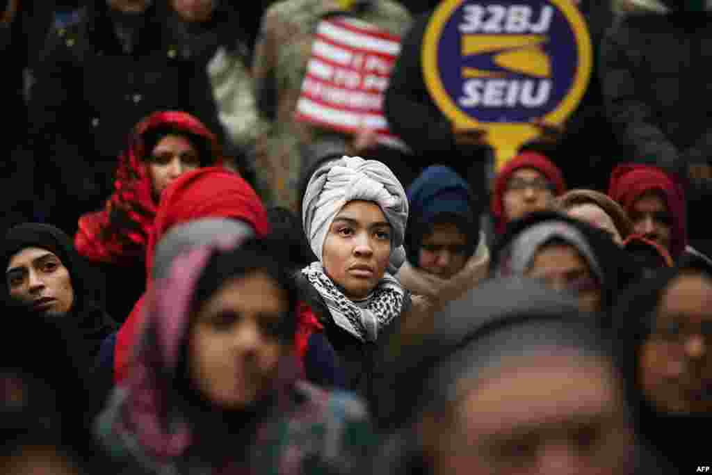 Area Muslims and local immigration activists participate in a prayer and rally against President Donald Trump's immigration policies in New York City.