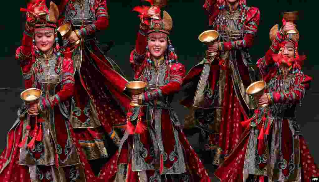 Dancers from China&#39;s Inner Mongolia Art Troupe perform at the Abdulhusain Abdulredha theatre in Kuwait City, Kuwait.