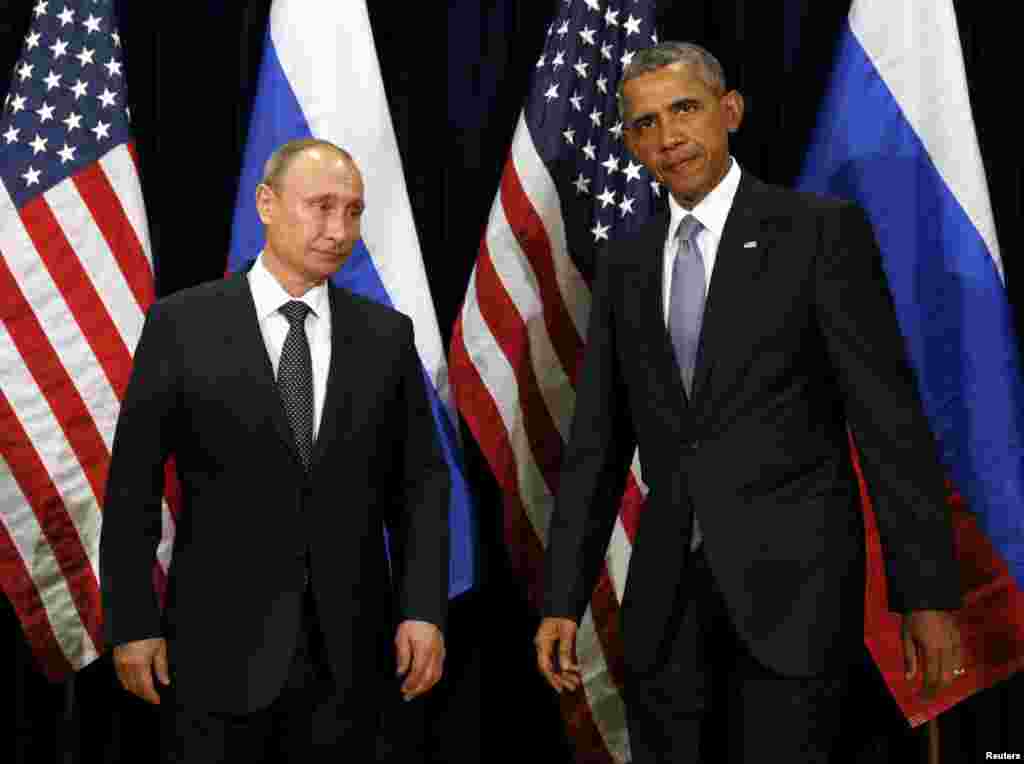 Presiden AS Barack Obama dan Presiden Rusia Vladimir Putin bertemu di Sidang Majelis Umum PBB di New York (28/9). (Reuters/Kevin Lamarque)
