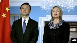 Secretary of State Hillary Rodham Clinton, right, talks during a meeting with Chinese Foreign Minister Yang Jiechi, left, at the State Department, Washington, Jan 5, 2011.