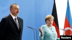 German Chancellor Angela Merkel and President of Azerbaijan Ilham Aliyev attend a news conference following talks at the Chancellery in Berlin, Germany, June 7, 2016. REUTERS/Axel Schmidt