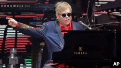 FILE - Elton John performs following the Formula One U.S. Grand Prix auto race at the Circuit of the Americas in Austin, Texas, Oct. 25, 2015.