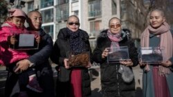 From left, Yuan Shanshan, Liu Ermin, Wang Qiaoling and Li Wenzu pose for the media after they shaved their heads to protest the detention of their husbands in Beijing on Dec. 17, 2018.