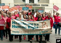Supporters of single-payer health care march to the Capitol in Sacramento, Calif., April 26, 2017.