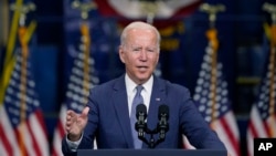 FILE - President Joe Biden speaks at an event in Kearny, New Jersey, Oct. 25, 2021. Biden has promised to show that democracies can work together to meet the challenges of the 21st century. He is now preparing to push that message at a global virtual summit.