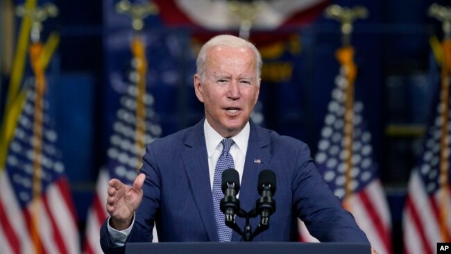 FILE - President Joe Biden speaks at an event in Kearny, New Jersey, Oct. 25, 2021. Biden has promised to show that democracies can work together to meet the challenges of the 21st century. He is now preparing to push that message at a global virtual summit.