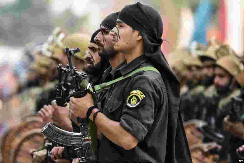 Newly recruited commandos take part in a parade at Manigam Ganderbal on the outskirts of Kashmir&#39;s capital Srinagar, India.