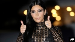 FILE - American television and social media personality, socialite, and model Kim Kardashian poses during a photocall at the Cannes Lions 2015, International Advertising Festival in Cannes, southern France.