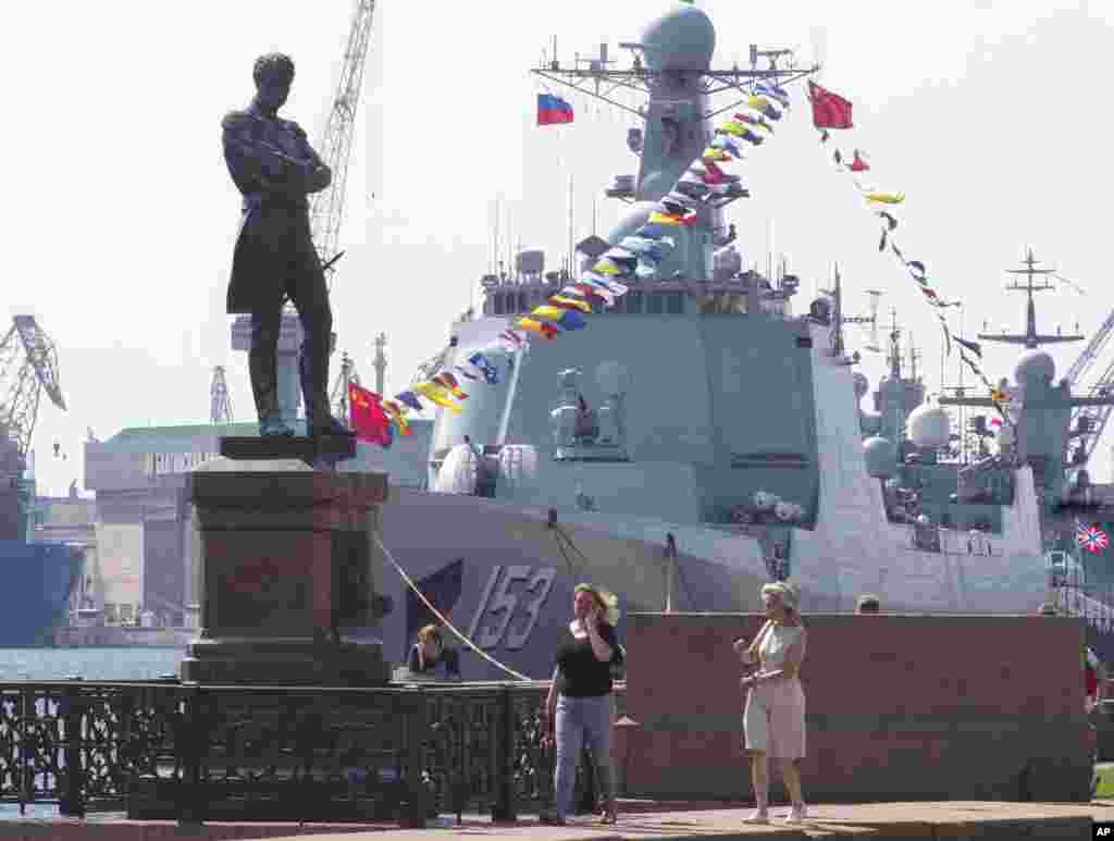 Chinese destroyer Xian is moored at the Neva River embankment in St.Petersburg, Russia, with a sculpture of admiral and explorer Ivan Krusenshtern on the left. The destroyer&nbsp; is there to take part in the Russian Navy Day Parade in Kronshtadt, outside St. Petersburg on July 28.