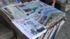 Newsstands behind Langka pagoda, along Pasteur street in Phnom Penh, Cambodia on September 27, 2015. Every morning, lots of customers come to buy or read newspapers there to know what is happening in the society. (Oum Sonita/VOA Khmer)