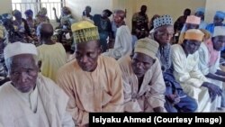 Men and women from Jigawa State wait for interviews to determine if they qualify for surgery to prevent blindness. 