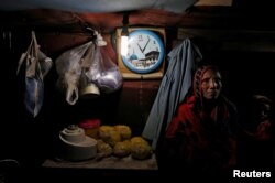 FILE - A family from the Rohingya community is pictured inside a shack in a camp in Delhi, India, Aug. 17, 2017.