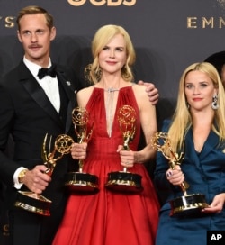 Alexander Skarsgard, from left, Nicole Kidman, and Resse Witherspoon pose in the press room with their awards for outstanding limited series for "Big Little Lies" at the 69th Primetime Emmy Awards, Sept. 17, 2017.