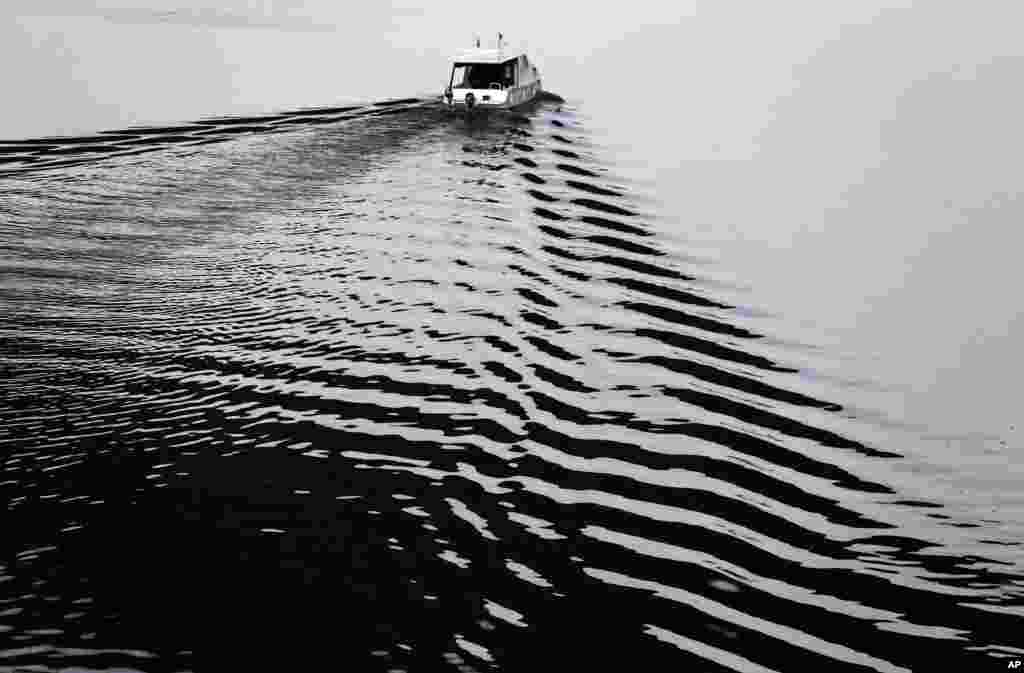 A boat cruises along the Sava River in Belgrade, Serbia.