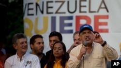 FILE - Opposition spokesman Jesus Torrealba (R) speaks during a campaign rally in Caracas, Venezuela, Nov. 13, 2015.