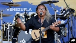 Reymar Perdomo sings "I Left," during the Venezuela Aid Live concert on the Colombian side of the Tienditas International Bridge near Cucuta, Colombia, on the border with Venezuela, Feb. 22, 2019.