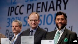 Co-Chairmen of the IPCC Working Group III Ramon Pichs Madruga and Ottmar Edenhofer pose with Rejendra K. Pachauri, Chairman of the IPCC prior to a press conference in Berlin, Germany, April 13, 2014.