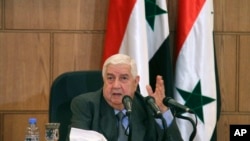 In this photo released by the Syrian official news agency SANA, Syrian Foreign Minister Walid Moallem, speaks during a press conference, in Damascus, Syria, April 6, 2017.