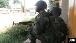 African Union intervention force (MISCA) secures the area during an operation to free the way leading to the north of Bangui on March 25, 2014. 