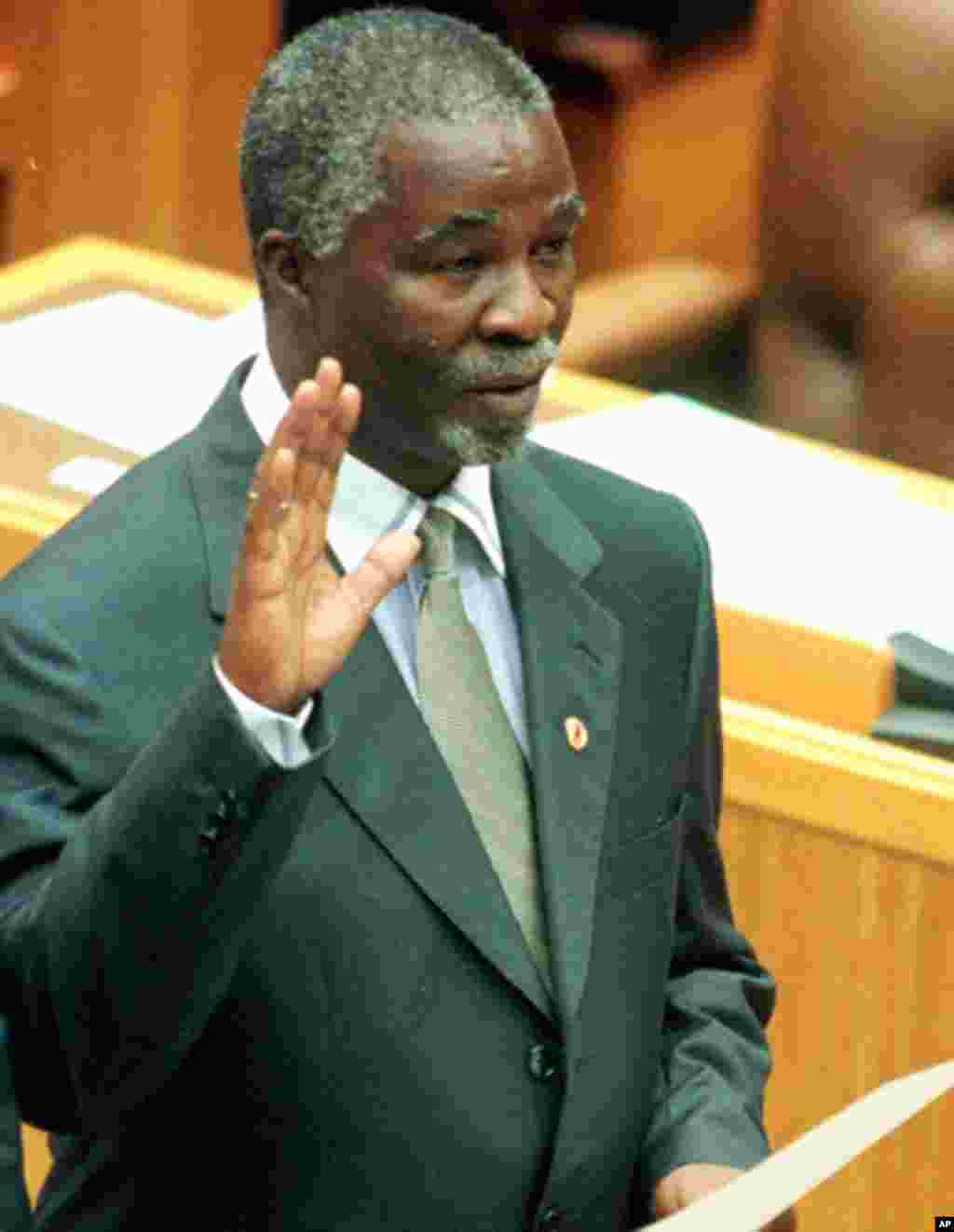 Then African National Congress leader Thabo Mbeki is sworn in as a member of parliament in Cape Town's Parliament, Monday June 14, 1999. (AP)