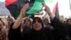 FILE - Women take part in a demonstration against the country's parliament and in support of the coalition of fighters called the Benghazi Revolutionaries Shura Council, at Freedom Square, Benghazi, Aug. 29, 2014.