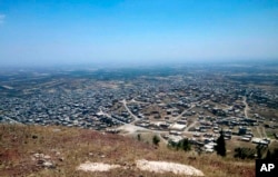 Photo released July 17, 2018 by the Syrian official news agency SANA shows a general view of Tell al-Haara, from the highest hill in the southwestern Daraa province, Syria.