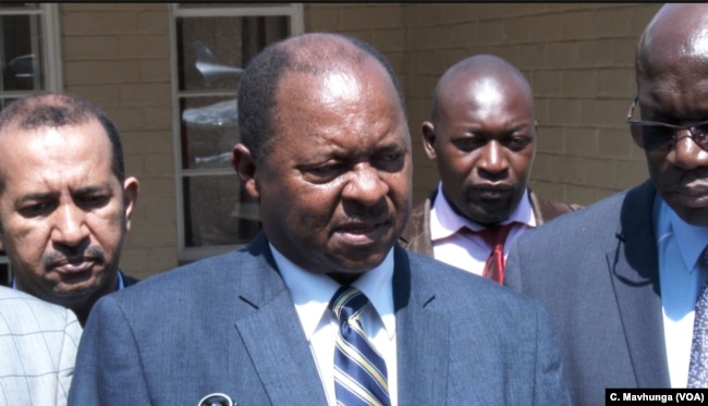 Zimbabwe's new health minister, Obadiah Moyo, telling reporters cholera that poor water supply, blocked sewers, and a failure to collect waste were making a cholera outbreak in the capital, Sept. 11, 2018.
