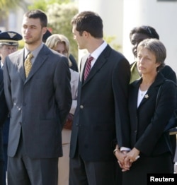 FILE - Annie Vieira (R), widow of Brazilian diplomat, Sergio Vieira de Mello, the United Nations chief envoy to Iraq, stands in mourning with her sons Laurent (L) and Adrian upon the arrival of Vieira de Mello's body at a military air base in Rio de Janeiro, Aug. 23, 2003.