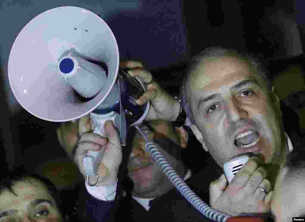 Turkey's ambassador to the Netherlands Sadik Arslan addresses crowds outside the Turkish consulate in Rotterdam, Netherlands, March 11, 2017.