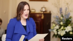 FILE - Minister for Small Business Kelly O'Dwyer is sworn in by Governor-General Peter Cosgrove at Government House in Canberra, Sept. 21, 2015.