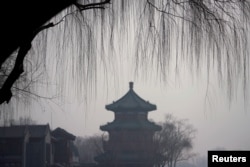 A traditional pavilion is seen amid smog in Beijing's Houhai area, China, Dec. 29, 2017.