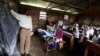 A teacher conducts a mathematics lesson to high school students in Democratic Republic of Congo town of Bunagana, Oct. 19, 2012. 