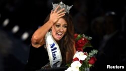 FILE - Miss North Dakota Cara Mund reacts after being announced as the winner of the 97th Miss America Competition in Atlantic City, New Jersey, Sept. 10, 2017.