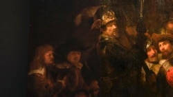 Detail of the Night Watch's left side, showing how Rembrandt's biggest painting just got bigger with the help of artificial intelligence in Amsterdam, Netherlands, Wednesday, June 23, 2021. (AP Photo/Peter Dejong)