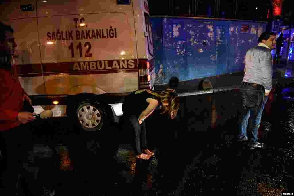 People flee from a nightclub where a gun attack took place during a New Year party in Istanbul, Jan. 1, 2017.