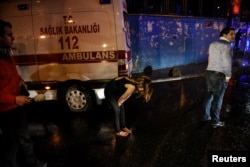 People flee from a nightclub where a gun attack took place during a New Year party in Istanbul, Jan. 1, 2017.