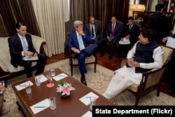 U.S. Secretary of State John Kerry, flanked by State Department Special Envoy and Coordinator for International Energy Affairs Amos Hochstein, sits with Indian Minister of Power Piyush Goyal on August 30, 2016, at the Le Meridien Hotel, in New Delhi, Indi