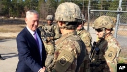 FILE - Defense Secretary Jim Mattis greets soliders at Fort Bragg, N.C, Dec. 22, 2017. 